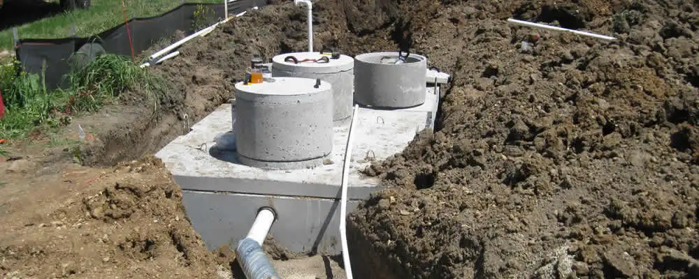 Septic system repair and installation site with tank access ports in Spokane, WA